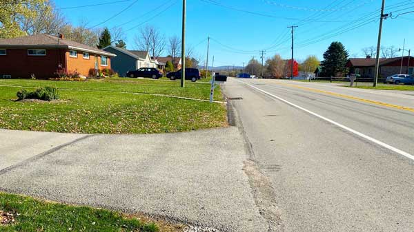 Drive way that opens into a shoulder on the roadway