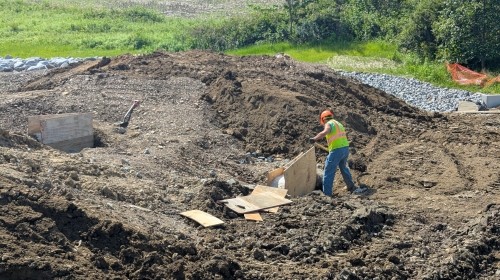 Construction worker alongside Bell Memorial Church Road
